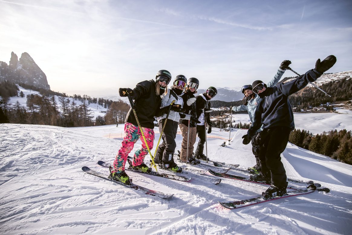 A group of female freeskiers gathers for an exclusive session at Seiser Alm.