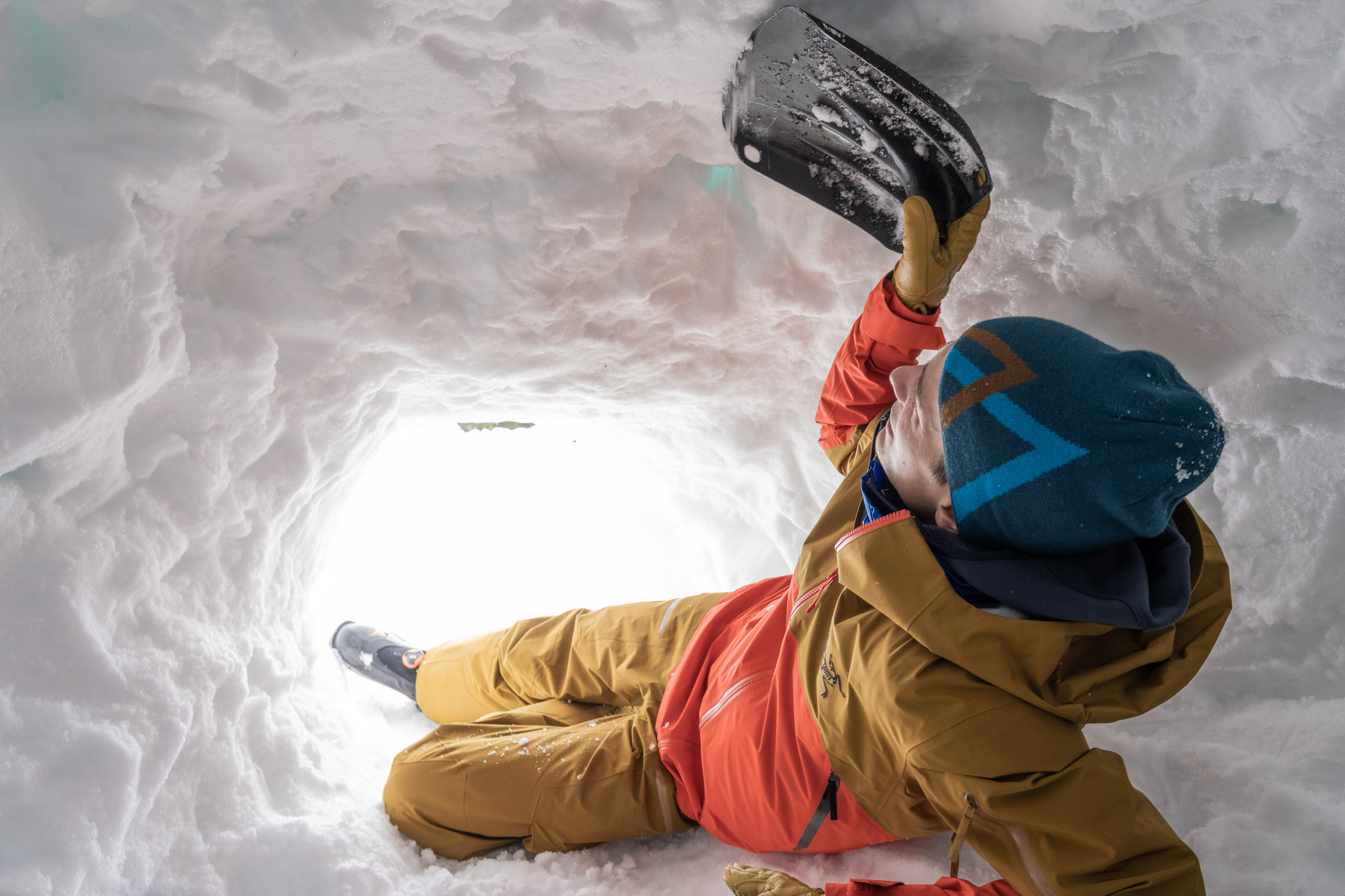 Benjamin Zörer digs a snow cave during the Arc'teryx Academy Freeride Edition
